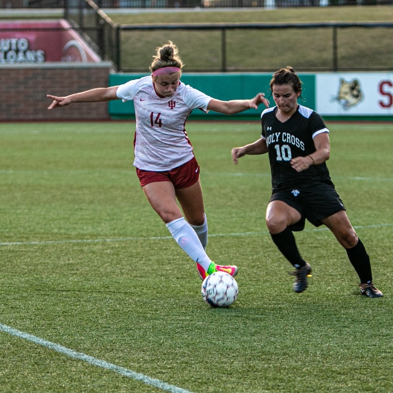 two student athletes during a soccer game.